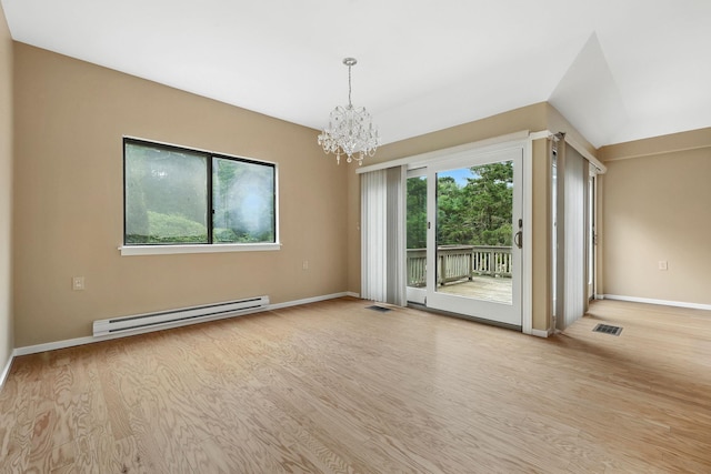 206 Heritage Unit A, Somers, NY 10589 - empty room with a baseboard radiator, a chandelier, and wood finished floors