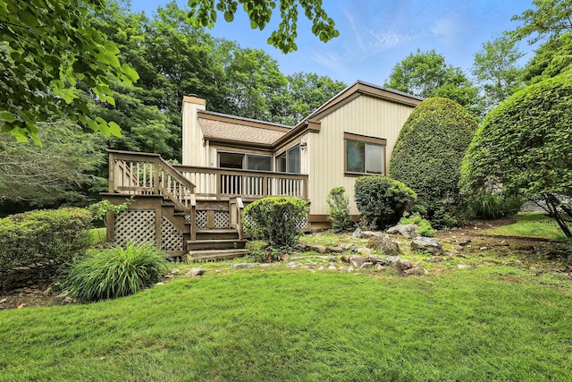 206 Heritage Unit A, Somers, NY 10589 - back of property with a chimney, a deck, and a yard