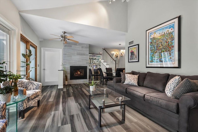 82 Wood Hollow Ln, New Rochelle, NY 10804 - living room with wood finished floors, stairway, a tiled fireplace, ceiling fan, and lofted ceiling