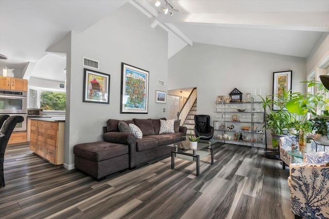 82 Wood Hollow Ln, New Rochelle, NY 10804 - living area with dark wood finished floors, stairs, beam ceiling, and high vaulted ceiling