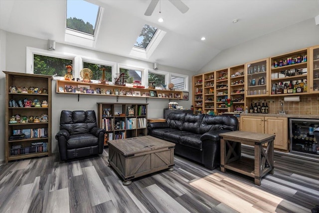 82 Wood Hollow Ln, New Rochelle, NY 10804 - sitting room with beverage cooler, a dry bar, a ceiling fan, wood finished floors, and lofted ceiling