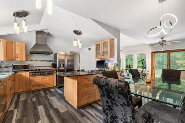 82 Wood Hollow Ln, New Rochelle, NY 10804 - kitchen featuring stainless steel appliances, wall chimney range hood, dark wood-style flooring, ceiling fan, and tasteful backsplash