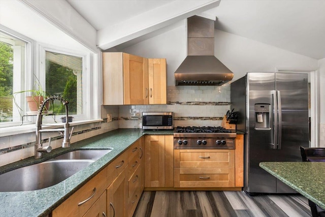 82 Wood Hollow Ln, New Rochelle, NY 10804 - kitchen featuring wall chimney range hood, stainless steel appliances, lofted ceiling, wood finished floors, and backsplash