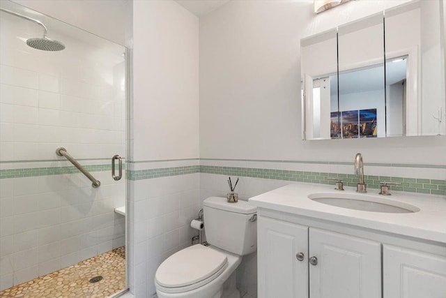 82 Wood Hollow Ln, New Rochelle, NY 10804 - full bath with a stall shower, vanity, tile walls, and wainscoting