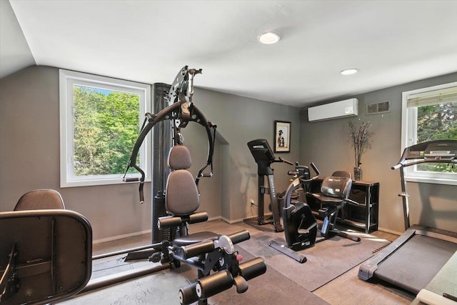 82 Wood Hollow Ln, New Rochelle, NY 10804 - exercise area with an AC wall unit, recessed lighting, and vaulted ceiling