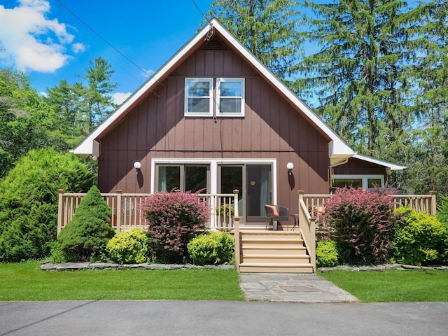 75 Hartung Rd, Eldred, NY 12743 - view of front of property with a wooden deck and a front lawn