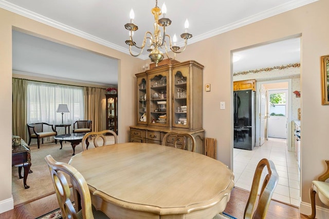 7 Mildred Ct, Nesconset, NY 11767 - dining room with a chandelier and ornamental molding