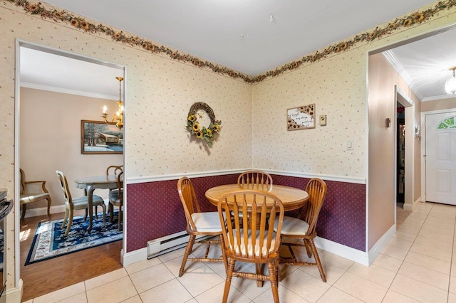 7 Mildred Ct, Nesconset, NY 11767 - tiled dining room featuring wallpapered walls, crown molding, a chandelier, and a wainscoted wall