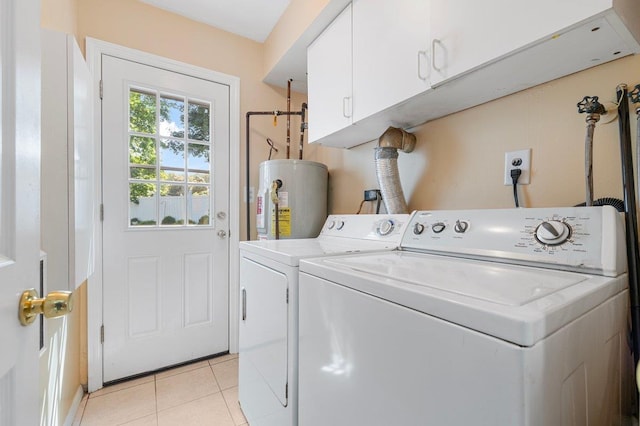 7 Mildred Ct, Nesconset, NY 11767 - laundry area featuring water heater, cabinet space, light tile patterned floors, and washer and dryer