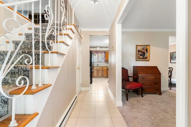 7 Mildred Ct, Nesconset, NY 11767 - foyer entrance featuring baseboard heating, stairs, crown molding, light tile patterned floors, and light colored carpet