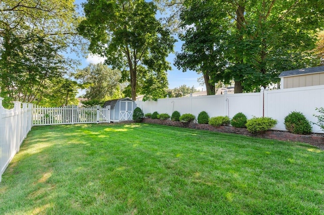 7 Mildred Ct, Nesconset, NY 11767 - fenced backyard featuring a storage unit