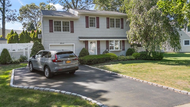 7 Mildred Ct, Nesconset, NY 11767 - traditional-style home featuring driveway and an attached garage