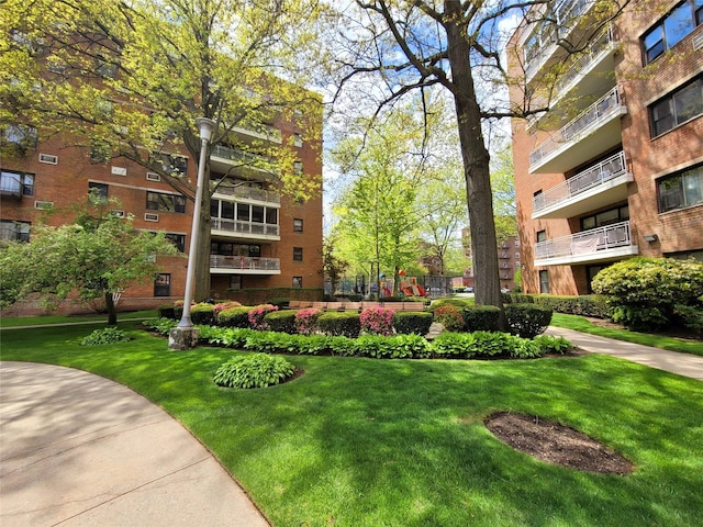 89-40 151st Ave Unit 5F, Howard Beach, NY 11414 - view of community with a lawn