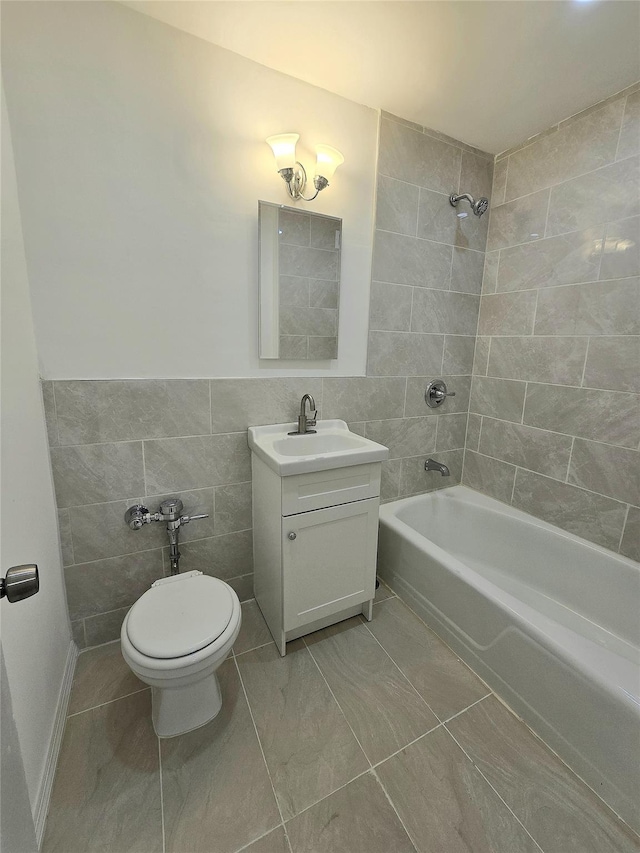 89-40 151st Ave Unit 5F, Howard Beach, NY 11414 - full bathroom featuring vanity, shower / bath combination, and tile walls