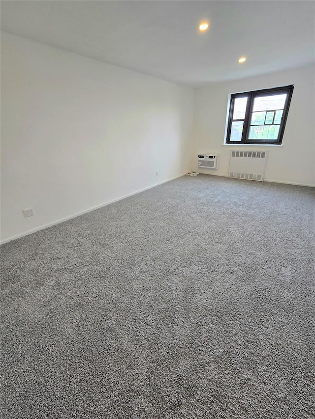 89-40 151st Ave Unit 5F, Howard Beach, NY 11414 - unfurnished room featuring radiator, recessed lighting, carpet floors, and an AC wall unit