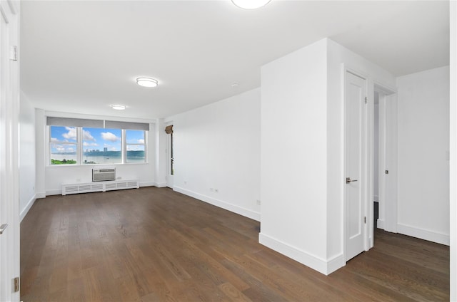 5700 Arlington Ave Unit 12T, Bronx, NY 10471 - empty room featuring dark wood finished floors and a wall unit AC