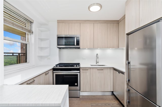 5700 Arlington Ave Unit 12T, Bronx, NY 10471 - kitchen with stainless steel appliances, light brown cabinets, modern cabinets, and light countertops