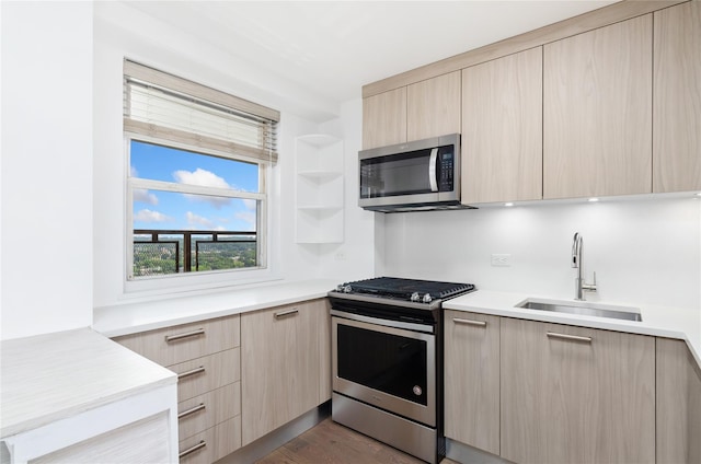 5700 Arlington Ave Unit 12T, Bronx, NY 10471 - kitchen with stainless steel appliances, modern cabinets, light brown cabinetry, and light countertops