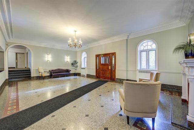 111-39 76th Rd Unit E2, Forest Hills, NY 11375 - foyer entrance with arched walkways, crown molding, a chandelier, and inlaid floor details