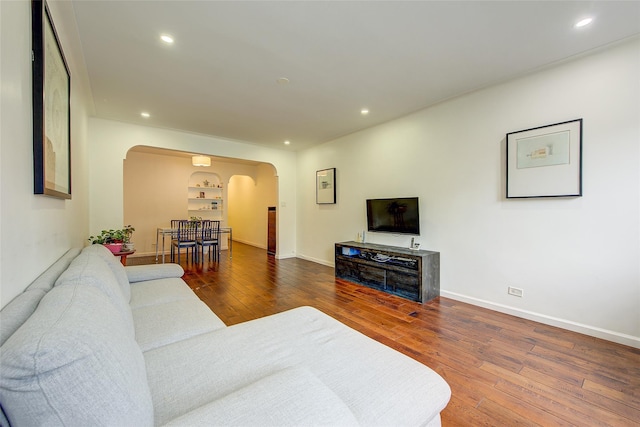 111-39 76th Rd Unit E2, Forest Hills, NY 11375 - living area featuring arched walkways, wood-type flooring, and recessed lighting
