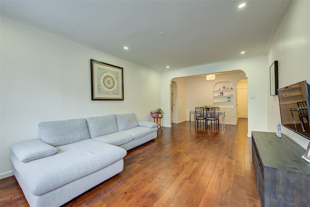 111-39 76th Rd Unit E2, Forest Hills, NY 11375 - living room with arched walkways, dark wood-style flooring, and recessed lighting