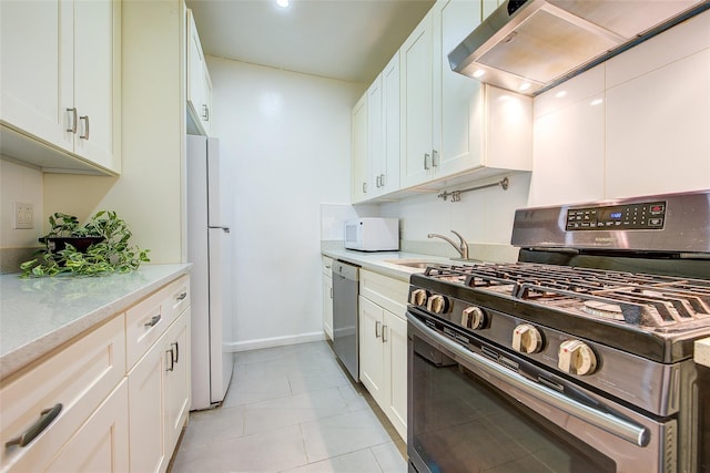 111-39 76th Rd Unit E2, Forest Hills, NY 11375 - kitchen featuring stainless steel appliances, extractor fan, white cabinets, and light tile patterned floors