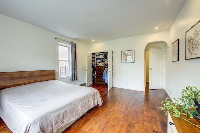 111-39 76th Rd Unit E2, Forest Hills, NY 11375 - bedroom with arched walkways, wood finished floors, recessed lighting, and a walk in closet
