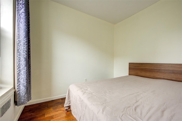 111-39 76th Rd Unit E2, Forest Hills, NY 11375 - bedroom with wood-type flooring and radiator