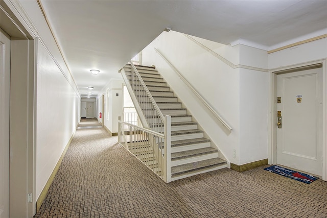 111-39 76th Rd Unit E2, Forest Hills, NY 11375 - stairs featuring carpet floors and baseboards