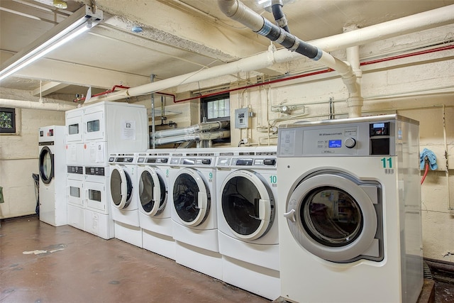 111-39 76th Rd Unit E2, Forest Hills, NY 11375 - communal laundry room with independent washer and dryer, estacked washer and dryer, and concrete block wall