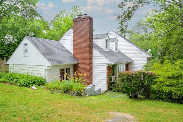9 Martin Rd, Yonkers, NY 10701 - view of home's exterior with a chimney, a lawn, and a shingled roof