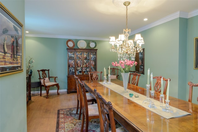 9 Martin Rd, Yonkers, NY 10701 - dining space featuring wood finished floors, crown molding, a chandelier, and recessed lighting