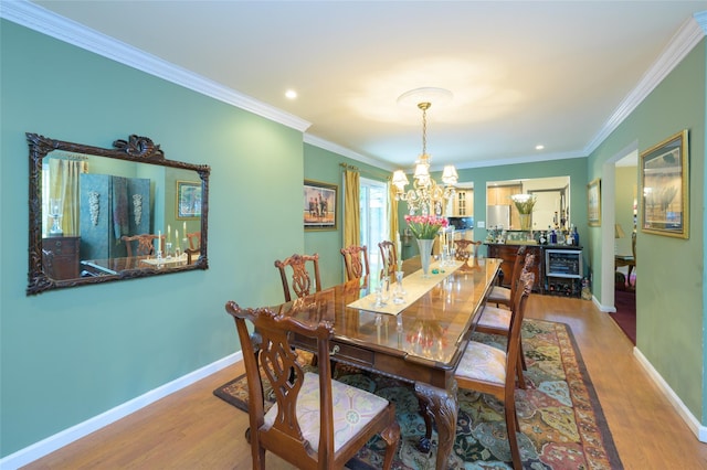 9 Martin Rd, Yonkers, NY 10701 - dining area with a chandelier, wood finished floors, crown molding, and recessed lighting