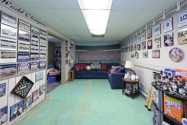 9 Martin Rd, Yonkers, NY 10701 - living room featuring a drop ceiling, finished concrete floors, and baseboard heating