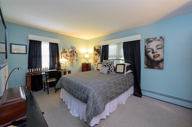 9 Martin Rd, Yonkers, NY 10701 - bedroom featuring multiple windows, light carpet, and a baseboard radiator