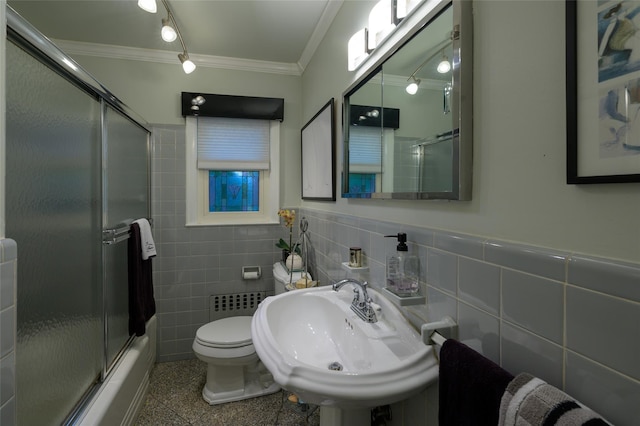 9 Martin Rd, Yonkers, NY 10701 - full bathroom featuring ornamental molding, tile walls, a wainscoted wall, combined bath / shower with glass door, and radiator