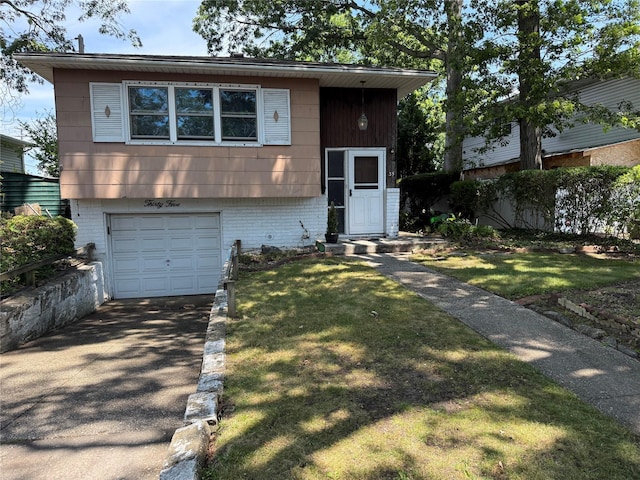 35 E Walnut St, Massapequa, NY 11758 - view of front of home with asphalt driveway, an attached garage, and a front yard