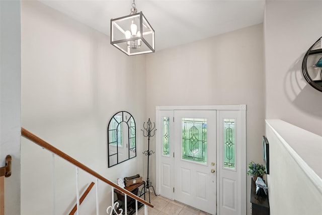 27A Claremont Ln, Suffern, NY 10901 - entryway with light tile patterned flooring, a chandelier, and a towering ceiling