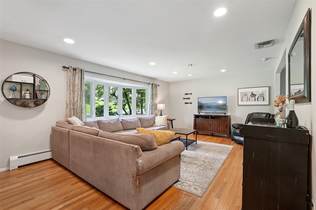27A Claremont Ln, Suffern, NY 10901 - living room with a baseboard heating unit, light wood-style flooring, and recessed lighting