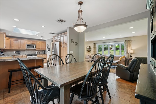 27A Claremont Ln, Suffern, NY 10901 - dining room with a skylight, recessed lighting, and light tile patterned flooring