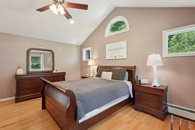 27A Claremont Ln, Suffern, NY 10901 - bedroom with baseboard heating, multiple windows, light wood-type flooring, a ceiling fan, and high vaulted ceiling