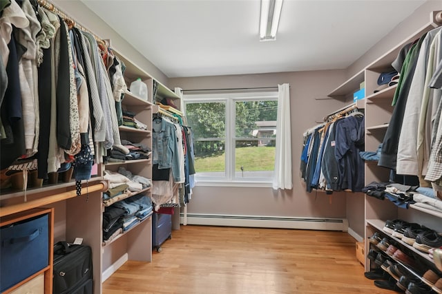 27A Claremont Ln, Suffern, NY 10901 - walk in closet featuring a baseboard radiator and light wood-style floors