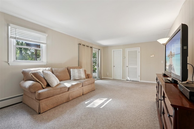 27A Claremont Ln, Suffern, NY 10901 - living area with light carpet and a baseboard radiator