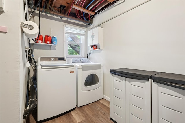 27A Claremont Ln, Suffern, NY 10901 - laundry room with washer and dryer and light wood-style floors