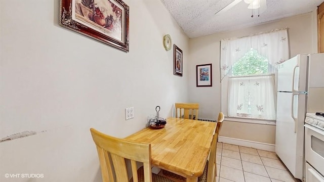 77-52 76th St, Glendale, NY 11385 - dining area featuring light tile patterned floors, ceiling fan, and a textured ceiling