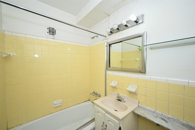 87-10 51st Ave Unit 6W, Elmhurst, NY 11373 - full bathroom featuring bathtub / shower combination, vanity, and tile walls