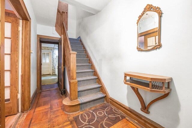 2117 38th St, Astoria, NY 11105 - staircase featuring baseboards