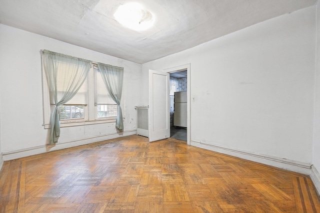 2117 38th St, Astoria, NY 11105 - spare room featuring baseboards
