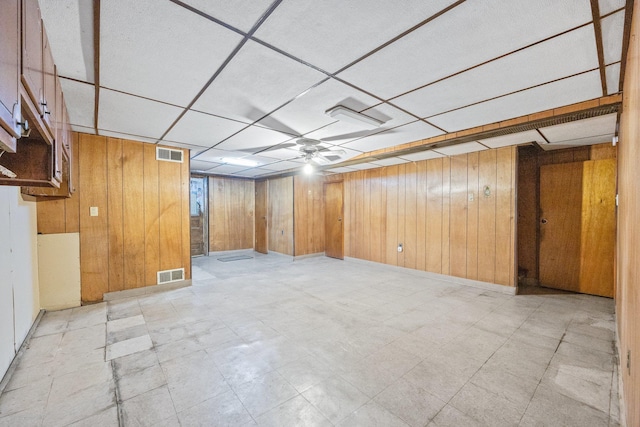 2117 38th St, Astoria, NY 11105 - finished below grade area featuring wood walls, a drop ceiling, and light floors