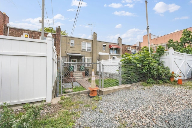 2117 38th St, Astoria, NY 11105 - back of house featuring a gate